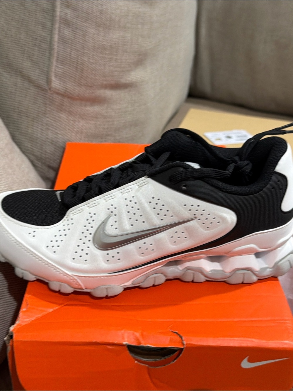 Nike Men’s White and Black Running Sneakers with Silver Swoosh